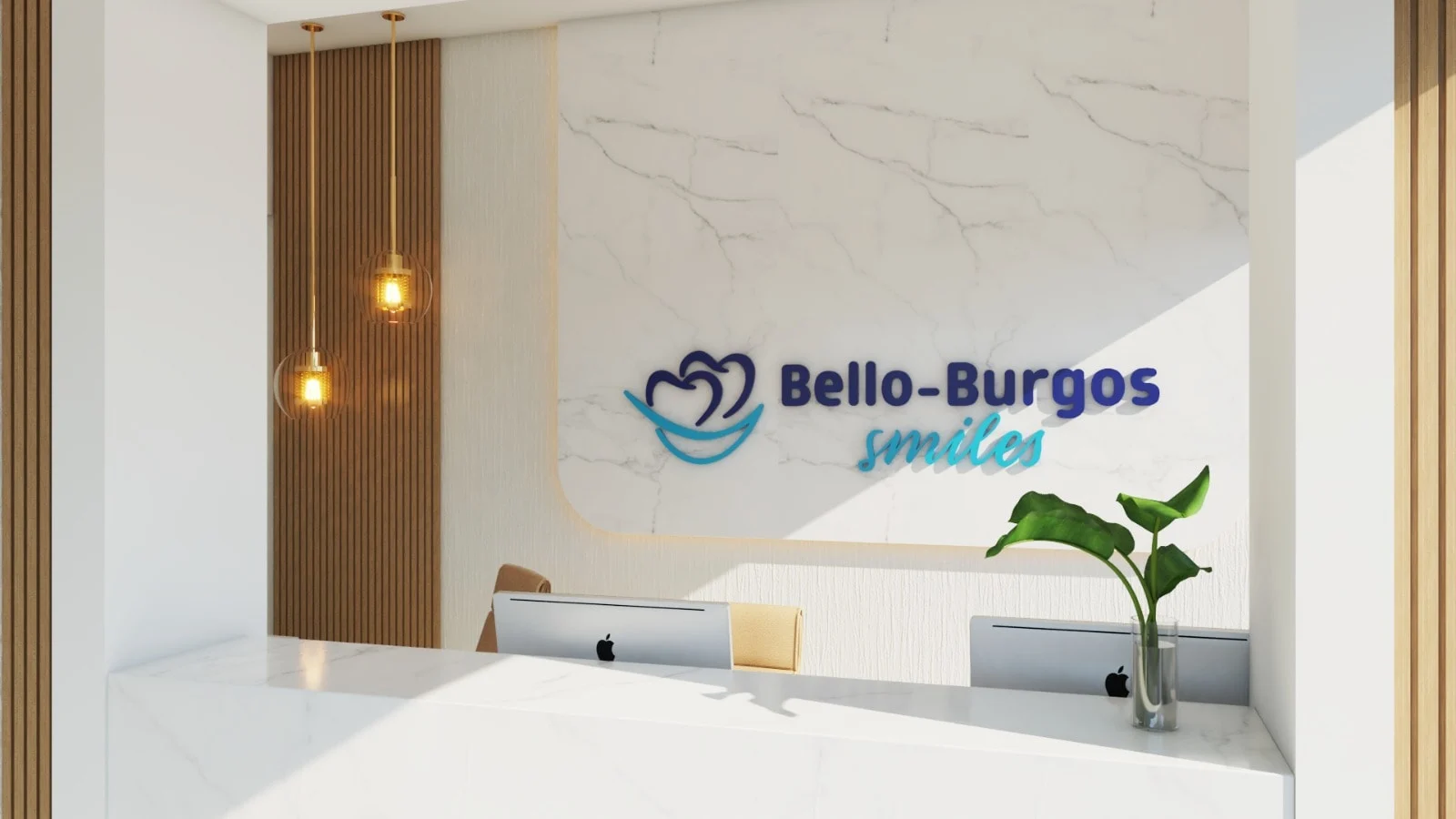 Bello-Burgos Smiles — Reception with a white marble-look desk under the “Bello-Burgos smiles” logo and brass-toned pendants