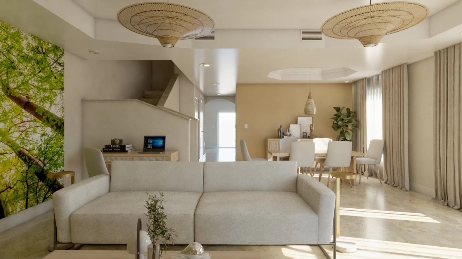 Casa Oliva — Front view of the white sofa, with the stairs, a small desk and the dining table behind it