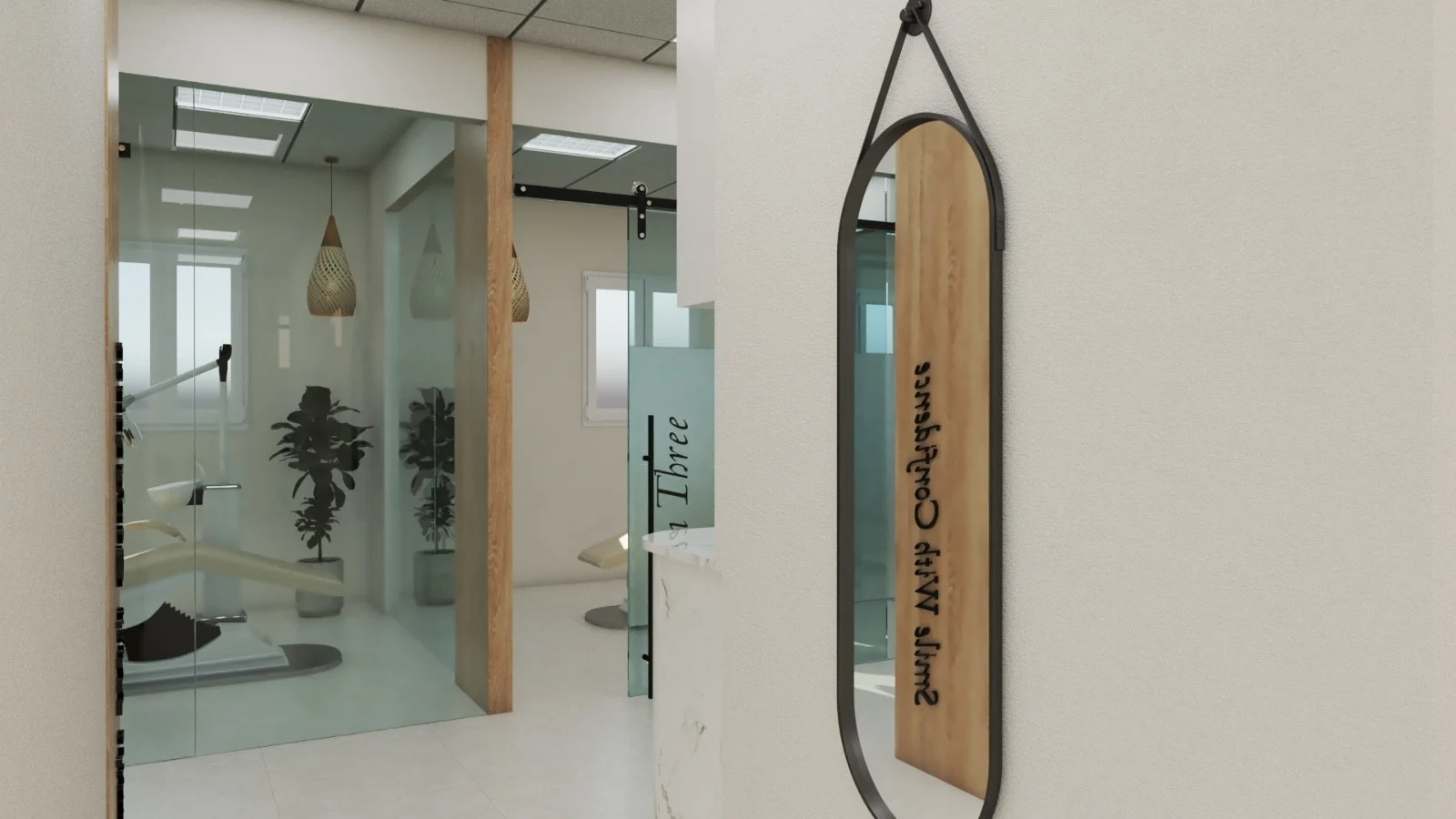 Habana Dental Care — Detail of an oval black-framed mirror hung from a strap, beside a view into glass-walled treatment rooms