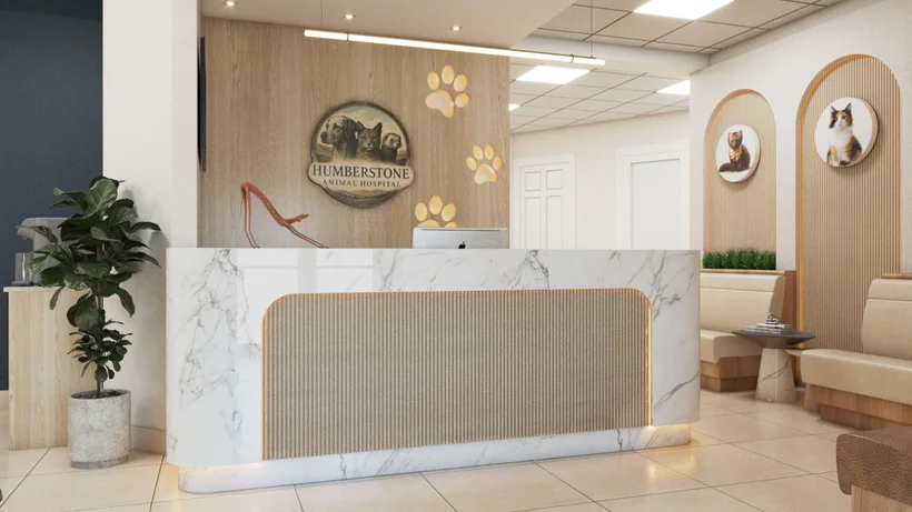 Veterinary Clinics — Reception with a marble-look desk under a round logo with a dog, cat and ferret, beside backlit paw prints