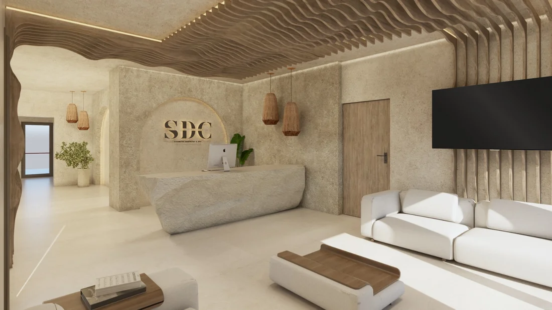 SDC — Smile Dental Center — Reception with a faceted stone-look desk under a wavy wood-slat ceiling and woven pendant lamps